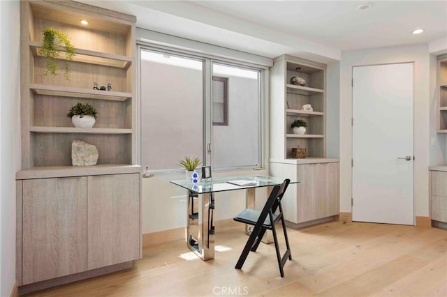 office space with light wood-type flooring