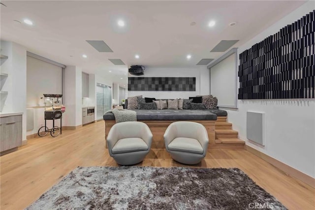 home theater room with light hardwood / wood-style flooring