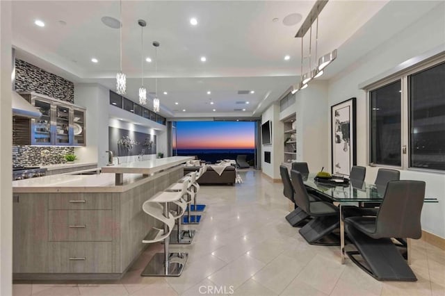 interior space with light tile patterned flooring and sink