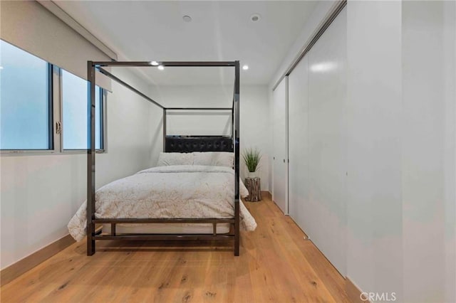 bedroom with light hardwood / wood-style floors