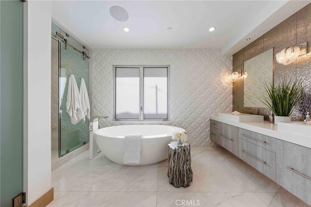 bathroom with shower with separate bathtub and vanity