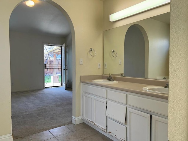 bathroom with tile patterned flooring and vanity