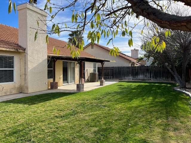 view of yard featuring a patio and central AC