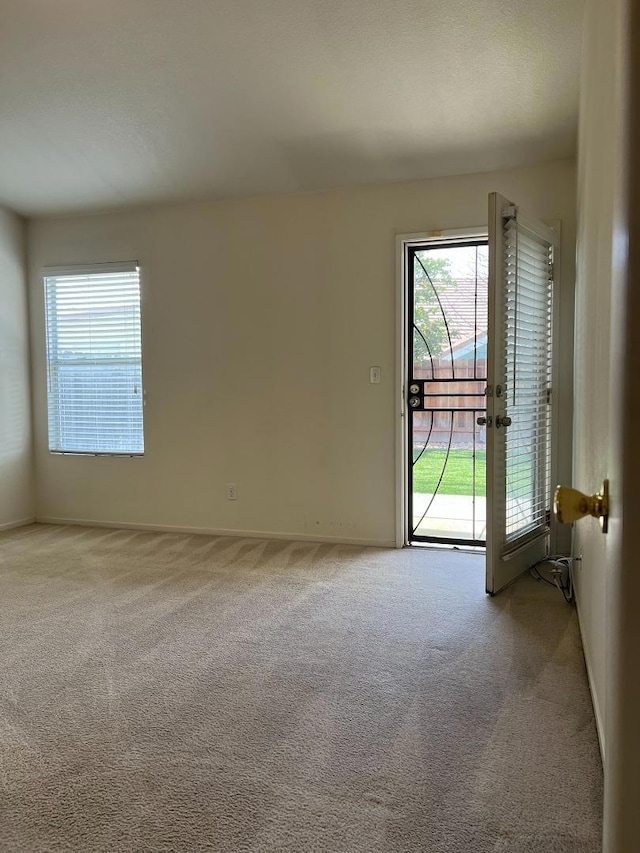 view of carpeted spare room