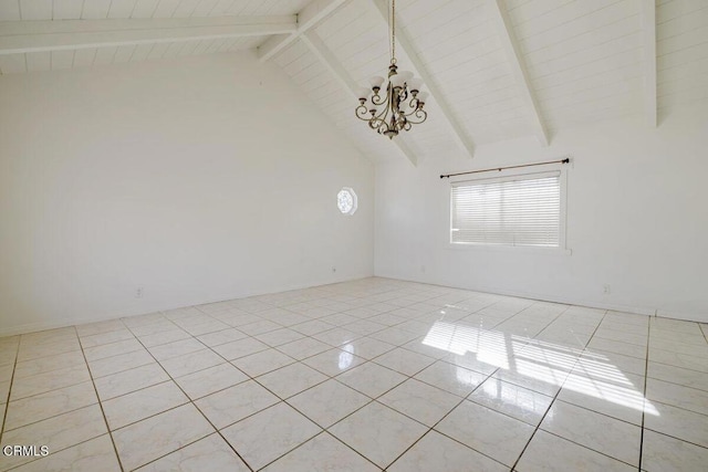 tiled spare room with an inviting chandelier, beam ceiling, and high vaulted ceiling