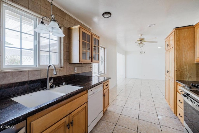 kitchen featuring ceiling fan, light tile patterned flooring, white dishwasher, pendant lighting, and sink