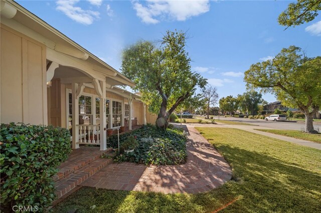 view of yard featuring a porch