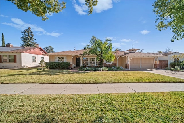 ranch-style home with a garage and a front yard