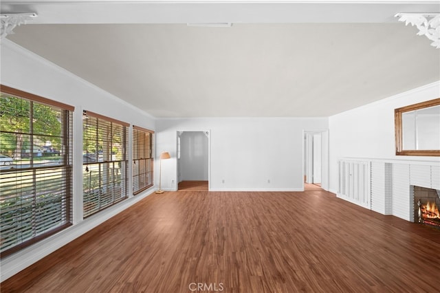 unfurnished living room with a fireplace and hardwood / wood-style flooring