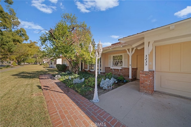 view of side of property with a lawn