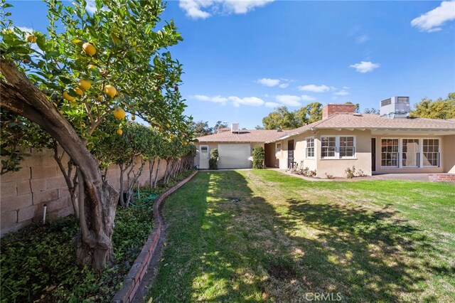 view of yard with a garage