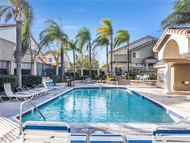 view of swimming pool with a patio