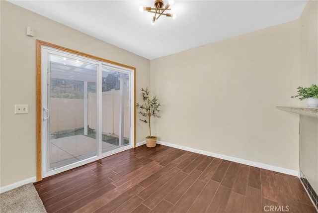 unfurnished room with an inviting chandelier