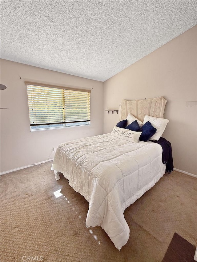 carpeted bedroom with a textured ceiling