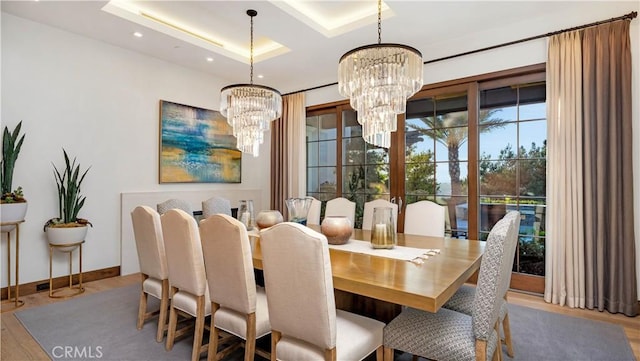 2 Thomas Rd, Ladera Ranch, CA 92694 - dining area with a chandelier, wood finished floors, recessed lighting, baseboards, and a raised ceiling