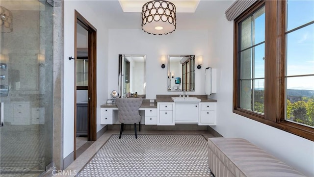 bathroom featuring vanity, an enclosed shower, and tile patterned floors