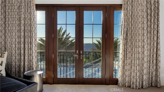 doorway with french doors and carpet floors