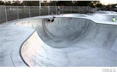view of pool with a fenced in pool and fence
