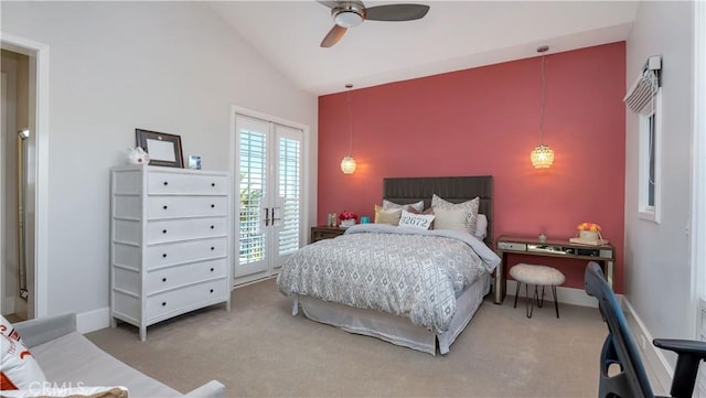 bedroom with french doors, high vaulted ceiling, access to outside, carpet floors, and ceiling fan