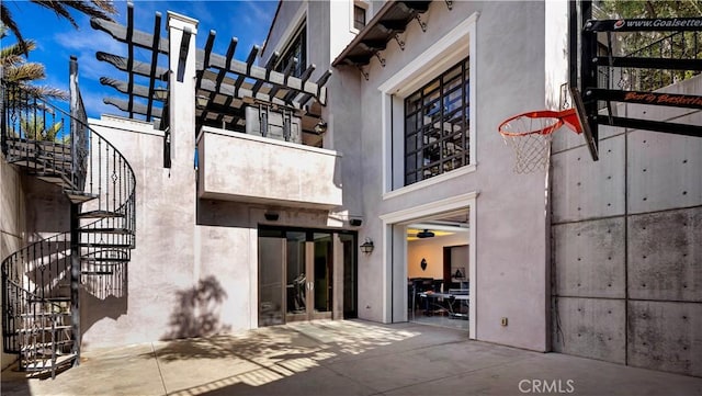 exterior space with a patio and stucco siding