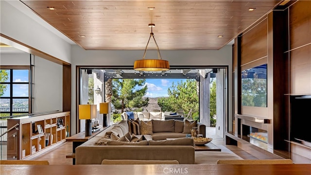 living room featuring wood ceiling and light hardwood / wood-style flooring