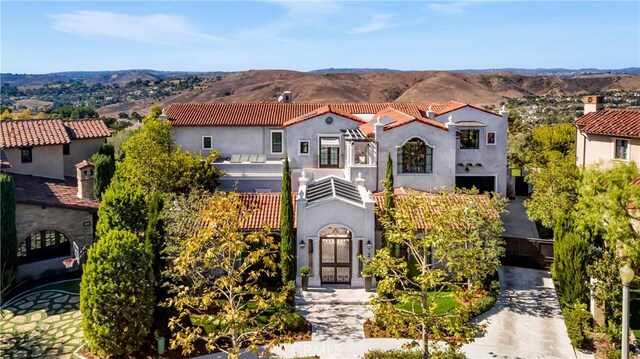 2 Thomas Rd, Ladera Ranch, CA 92694 - mediterranean / spanish house with a mountain view, stucco siding, and a balcony