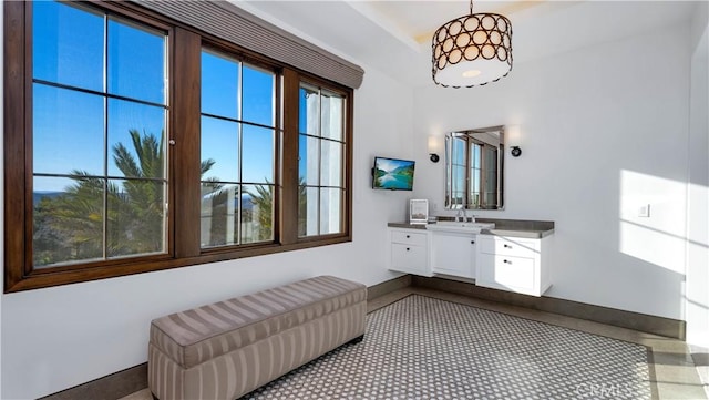 full bathroom with baseboards and vanity