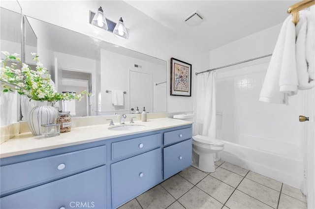 full bathroom with toilet, vanity, tile patterned flooring, and shower / bath combo