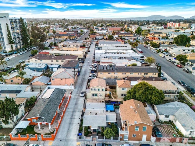 birds eye view of property with a mountain view