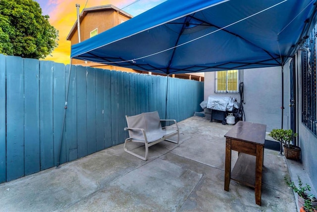 view of patio terrace at dusk