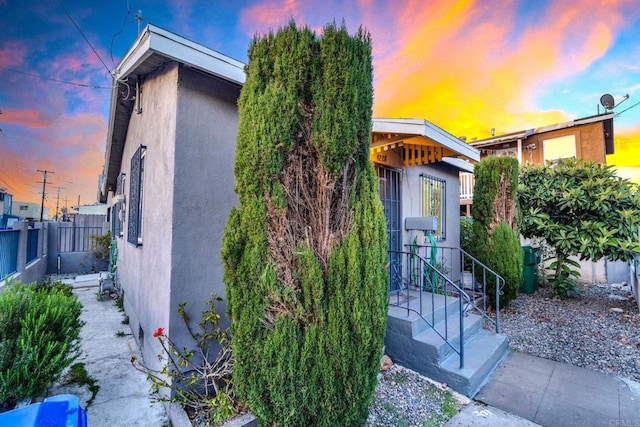 view of property exterior at dusk