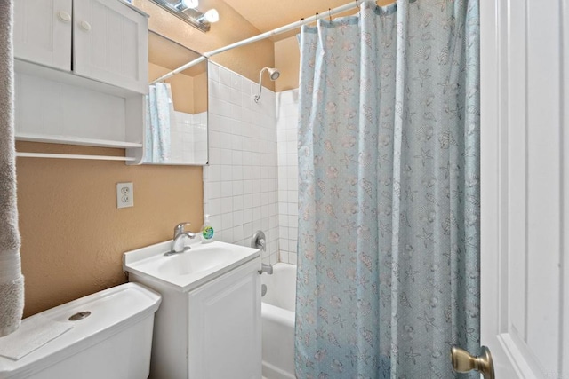 full bathroom with vanity, shower / tub combo with curtain, and toilet