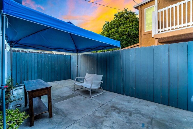 view of patio terrace at dusk