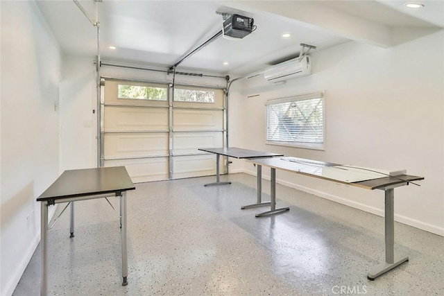 garage featuring a garage door opener and a wall unit AC