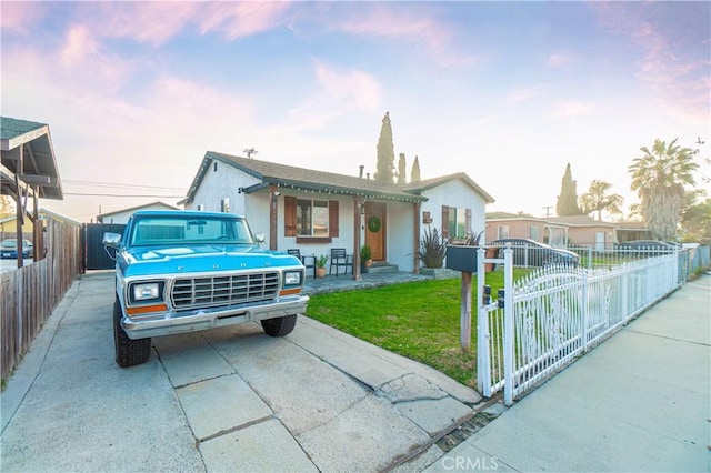 view of front of property with a yard