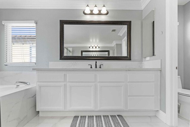 bathroom with toilet, crown molding, a tub, and vanity