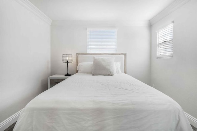 bedroom with crown molding