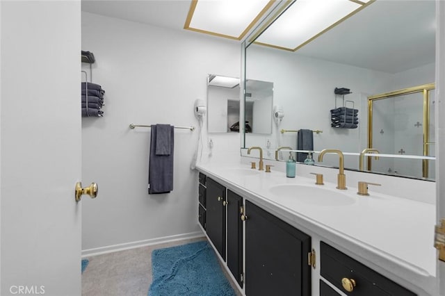 bathroom featuring an enclosed shower and vanity