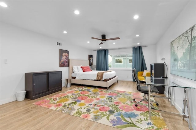 bedroom with ceiling fan, light hardwood / wood-style flooring, and access to outside