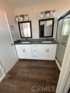 bathroom featuring hardwood / wood-style floors and vanity