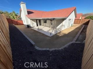 rear view of house featuring a patio area