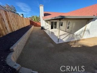 rear view of house with a patio