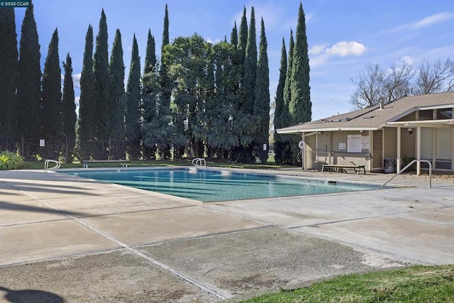 view of swimming pool with a patio area