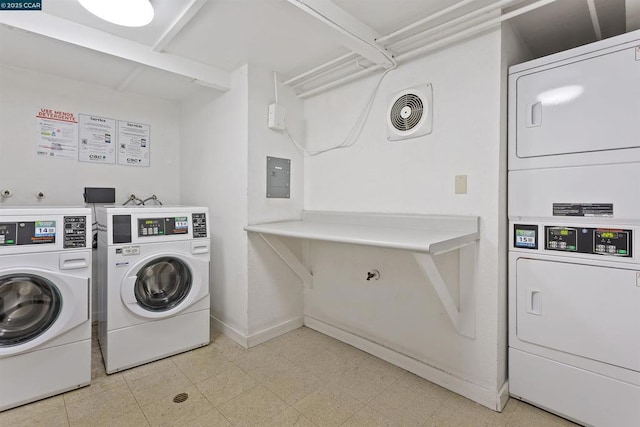 washroom featuring stacked washer / drying machine, independent washer and dryer, and electric panel