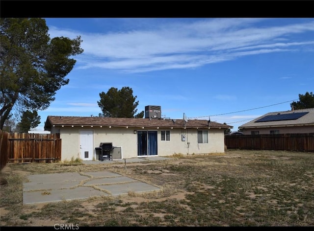 back of property featuring a patio area and central air condition unit