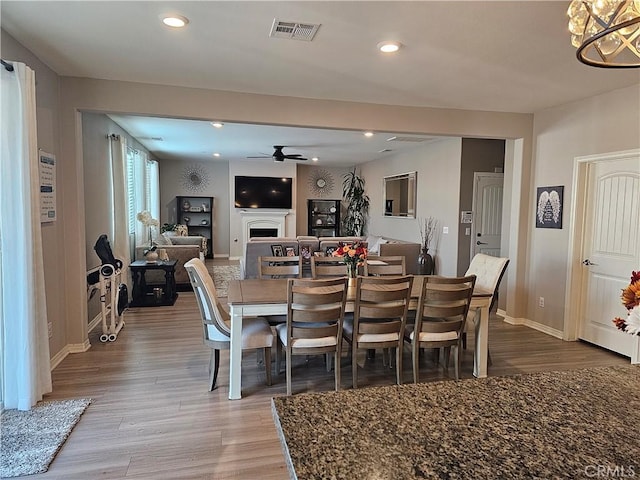 dining area featuring ceiling fan and hardwood / wood-style flooring