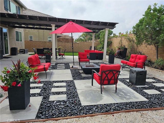 view of patio / terrace featuring an outdoor living space with a fire pit