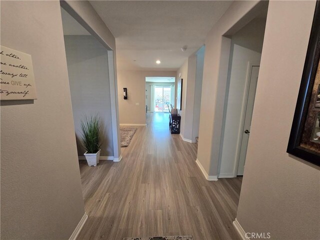 corridor featuring hardwood / wood-style floors