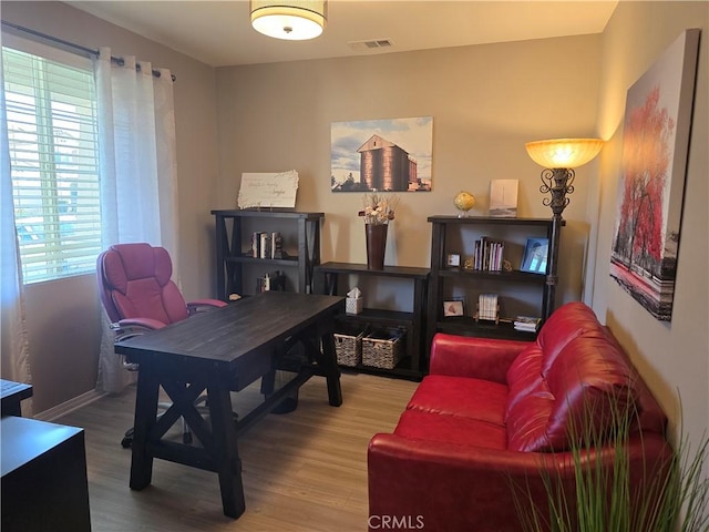 office area with hardwood / wood-style floors