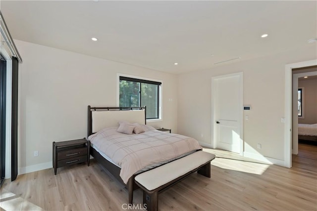 bedroom with light hardwood / wood-style flooring